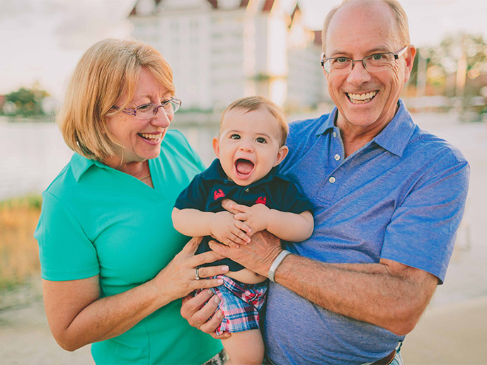 grandparents holding their newborn grandchild what is an iul
